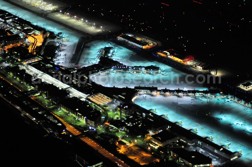 Frankfurt am Main at night from above - Night view of Runway with hangar taxiways and terminals on the grounds of the airport in Frankfurt in the state Hesse