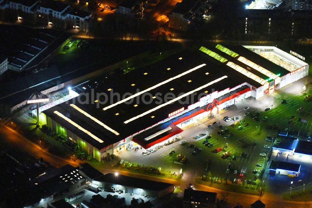 Aerial photograph at night Braunschweig - Night lighting Building of the construction market BAUHAUS Braunschweig on Hildesheimer Strasse in Brunswick in the state Lower Saxony, Germany