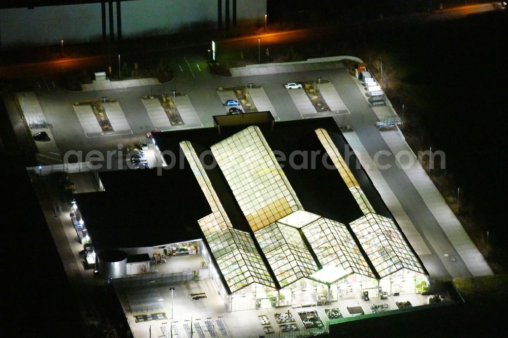 Nohra at night from above - Night lighting Building of Store plant market Dehner Gartencenter in of Querenstrasse in Nohra in the state Thuringia, Germany