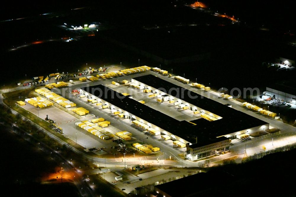 Nohra at night from above - Night lighting Building complex and grounds of the logistics center of DHL Paket GmbH on Stangenallee in Nohra in the state Thuringia, Germany