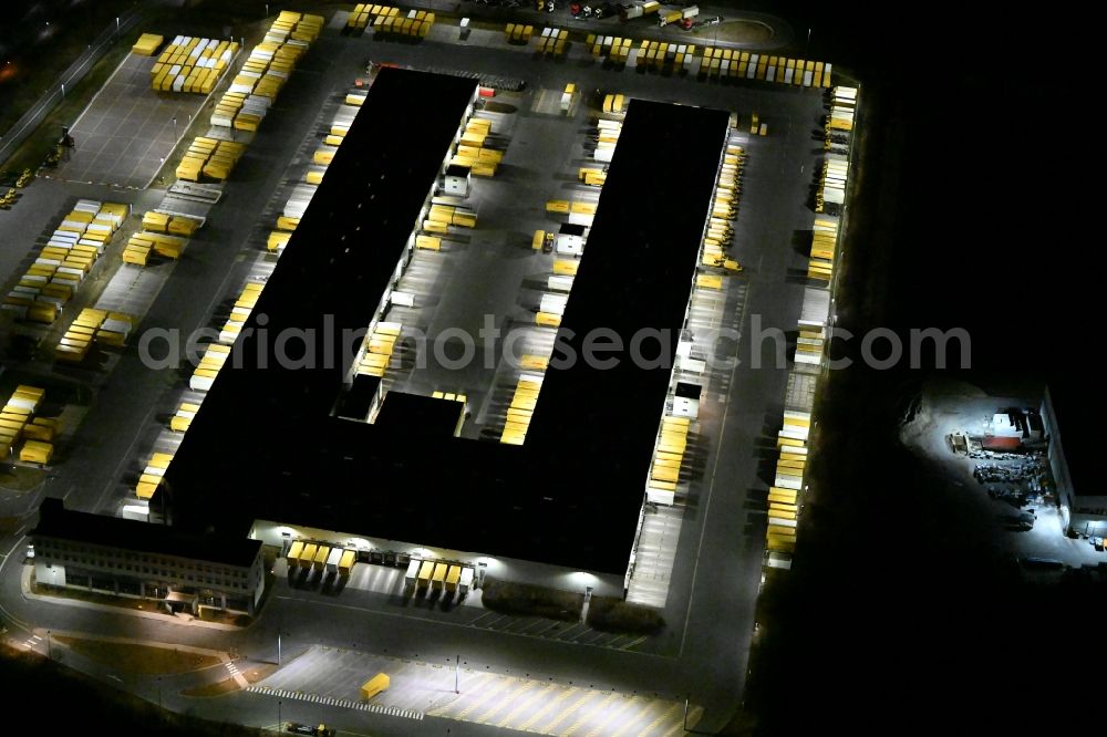 Nohra at night from above - Night lighting Building complex and grounds of the logistics center of DHL Paket GmbH on Stangenallee in Nohra in the state Thuringia, Germany