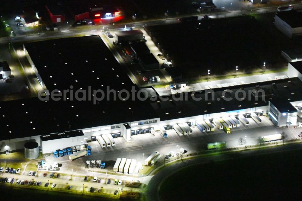 Gotha at night from above - Night lighting Building complex and grounds of the logistics center of Kraftverkehr Nagel GmbH & Co. KG in of Kurt-Nagel-Strasse in Gotha in the state Thuringia, Germany