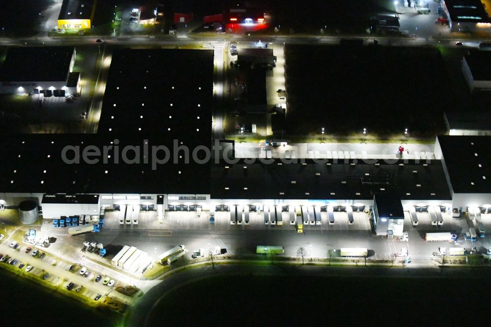 Aerial photograph at night Gotha - Night lighting Building complex and grounds of the logistics center of Kraftverkehr Nagel GmbH & Co. KG in of Kurt-Nagel-Strasse in Gotha in the state Thuringia, Germany