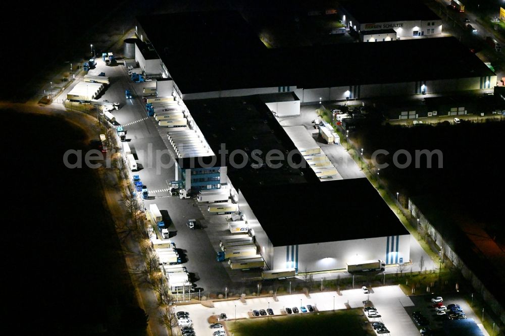 Gotha at night from the bird perspective: Night lighting Building complex and grounds of the logistics center of Kraftverkehr Nagel GmbH & Co. KG in of Kurt-Nagel-Strasse in Gotha in the state Thuringia, Germany