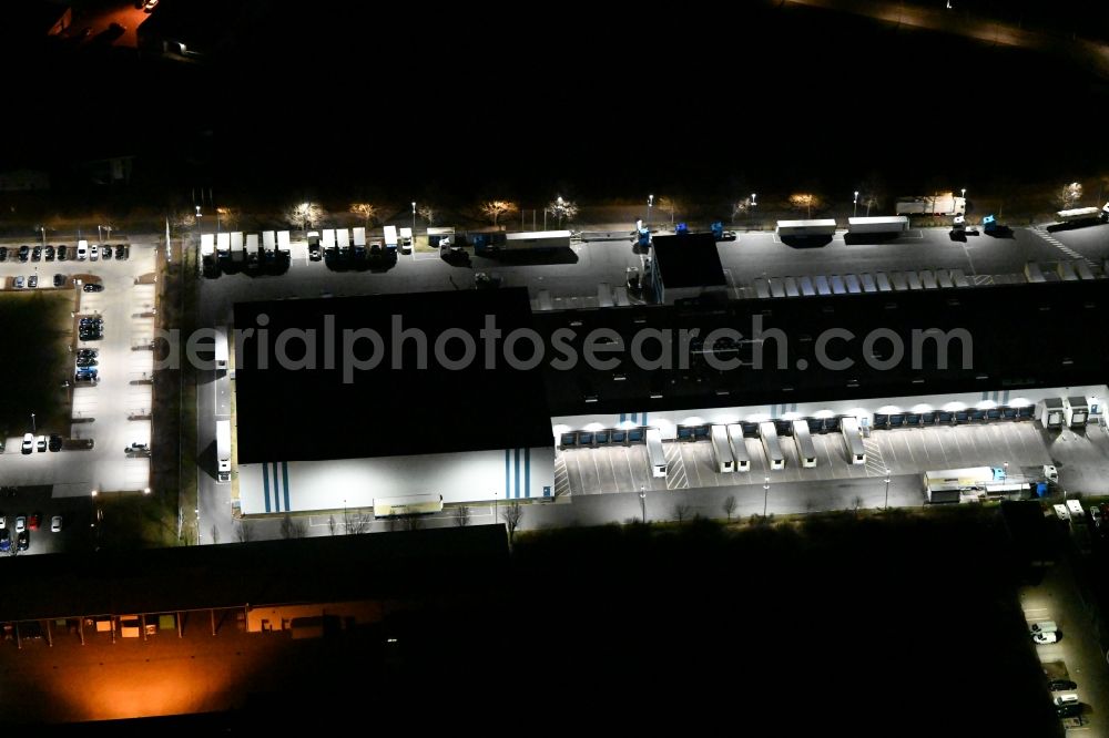 Gotha at night from above - Night lighting Building complex and grounds of the logistics center of Kraftverkehr Nagel GmbH & Co. KG in of Kurt-Nagel-Strasse in Gotha in the state Thuringia, Germany