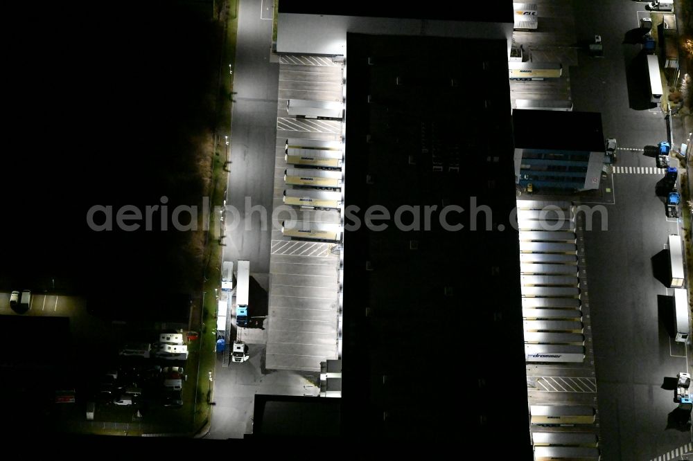 Aerial photograph at night Gotha - Night lighting Building complex and grounds of the logistics center of Kraftverkehr Nagel GmbH & Co. KG in of Kurt-Nagel-Strasse in Gotha in the state Thuringia, Germany