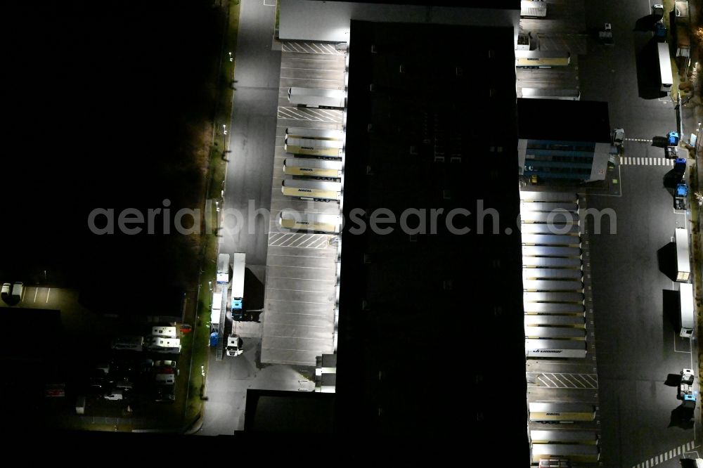 Aerial image at night Gotha - Night lighting Building complex and grounds of the logistics center of Kraftverkehr Nagel GmbH & Co. KG in of Kurt-Nagel-Strasse in Gotha in the state Thuringia, Germany