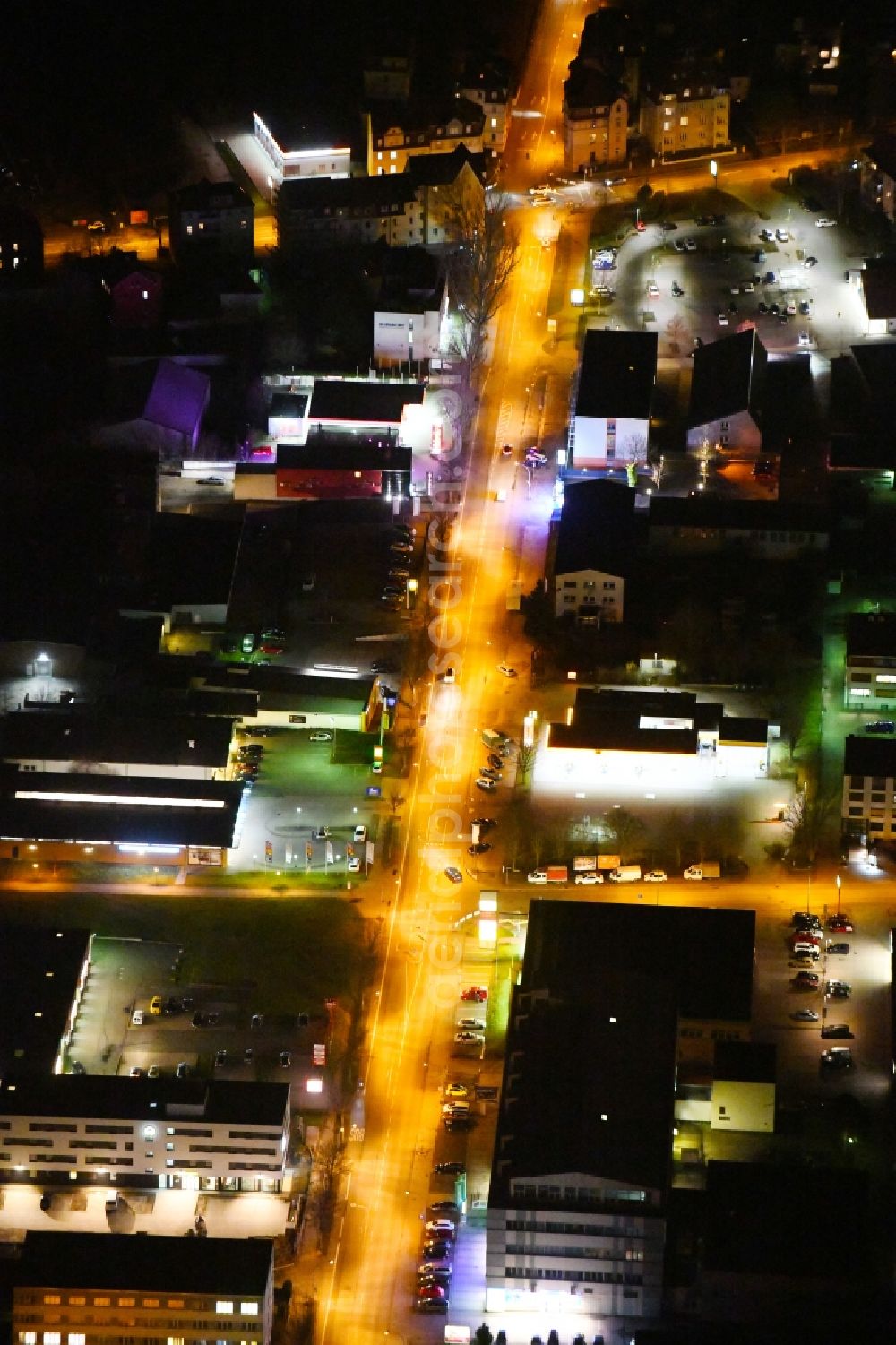 Weimar at night from above - Night lighting Industrial estate and company settlement along the Riessnerstrasse in Weimar in the state Thuringia, Germany