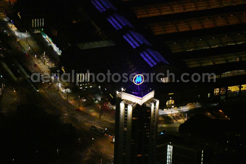 Leipzig at night from above - Night lighting the fair logotype neon sign on the roof of the High-Rise building complex of the headquarters of the Leipziger Wohnungs- und Baugesellschaft (LWB) on Wintergartenhochhaus - skyscraper in Leipzig in Saxony