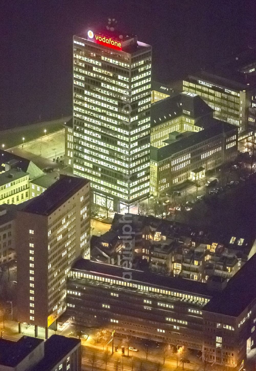 Aerial photograph at night Düsseldorf - Night aerial view of the building of the European headquarters of the telecommunications Konzernes Vodafone on the Rhine in Dusseldorf in North Rhine-Westphalia