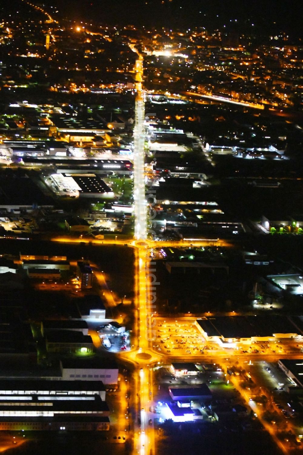 Aerial image at night Arnstadt - Night lighting Industrial and commercial area on Ichtershaeuser Strasse in Arnstadt in the state Thuringia, Germany