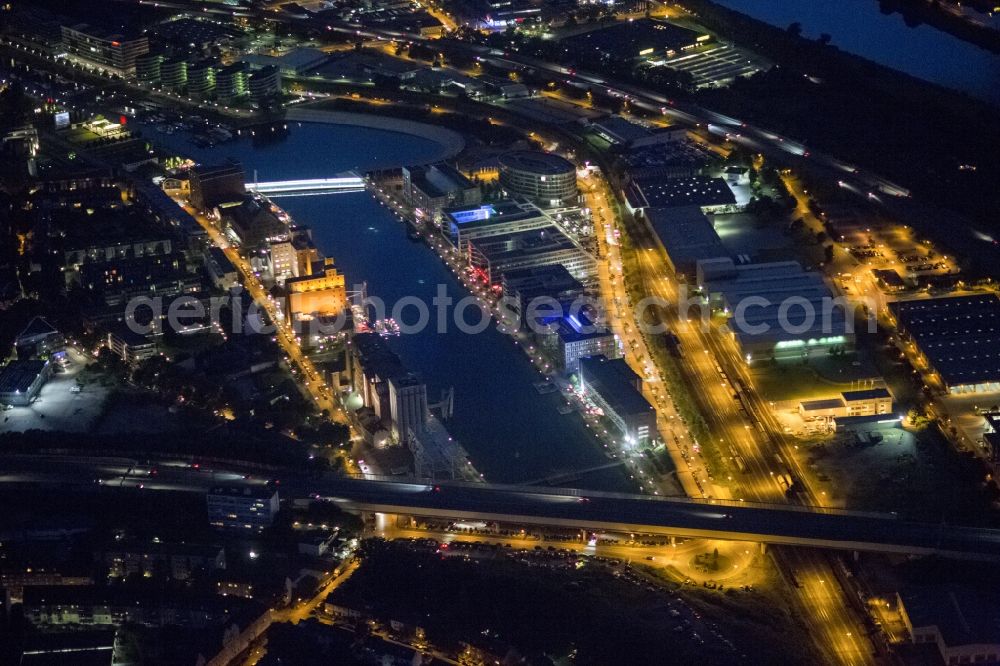 Aerial image at night Duisburg - Night Aerial View of the Inner Harbor district. The new use of the former inland port have different museums located