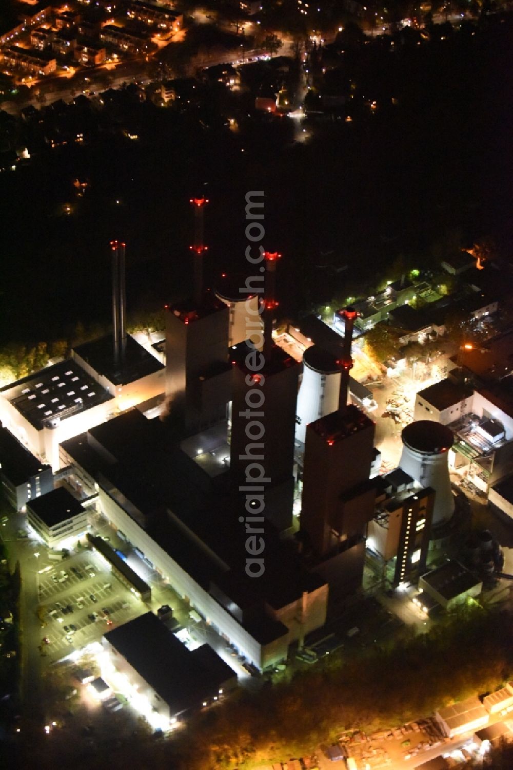 Aerial photograph at night Berlin - Night image of the Exhaust towers of the Vattenfall Europe AG at the canal eltowkanal in Berlin Lichterfelde