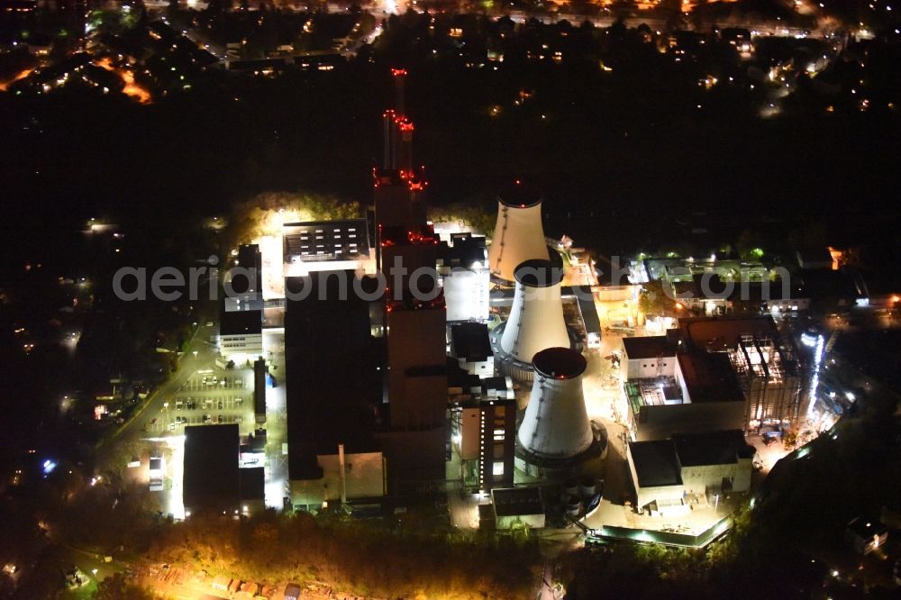 Aerial image at night Berlin - Night image of the Exhaust towers of the Vattenfall Europe AG at the canal eltowkanal in Berlin Lichterfelde