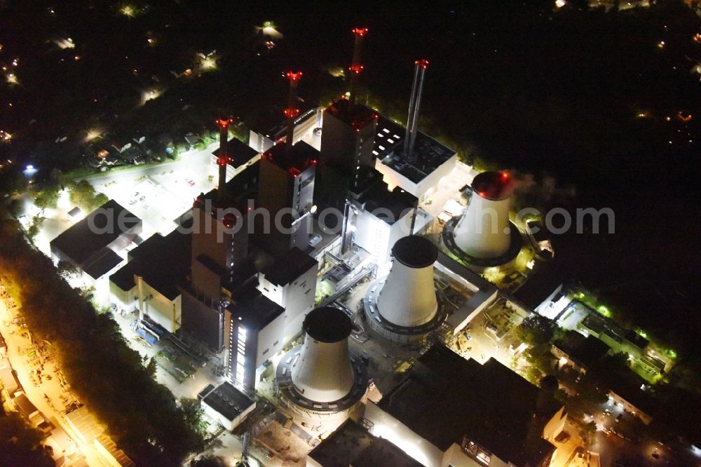 Aerial photograph at night Berlin - Night image of the Exhaust towers of the Vattenfall Europe AG at the canal eltowkanal in Berlin Lichterfelde