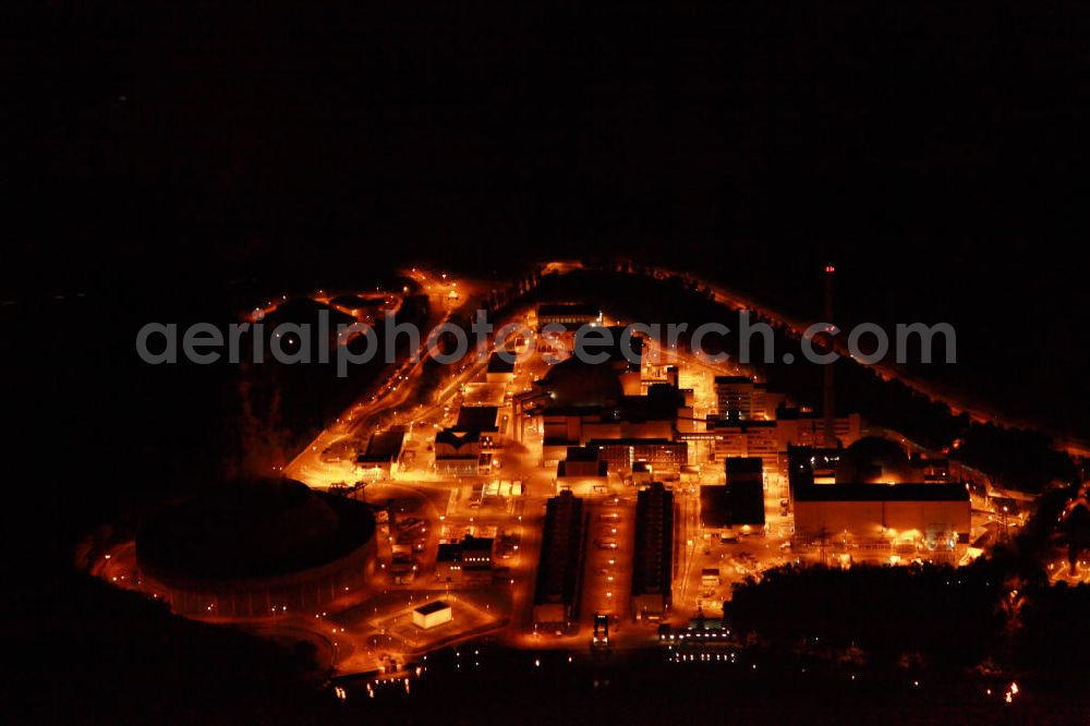 Aerial photograph at night Neckarwestheim - Nachtluftbildaufnahme vom beleuchteten Areal des Atomkraftwerk Neckarwestheim auf dem Gebiet der Gemeinden Neckarwestheim und Gemmrigheim am Ufer des Neckars. Betreiber des Kraftwerks ist das EnBW-Tochterunternehmen EnBW Kernkraft GmbH.Night Shot: The nuclear power station Neckarwestheim on the right bank of the Neckar river.