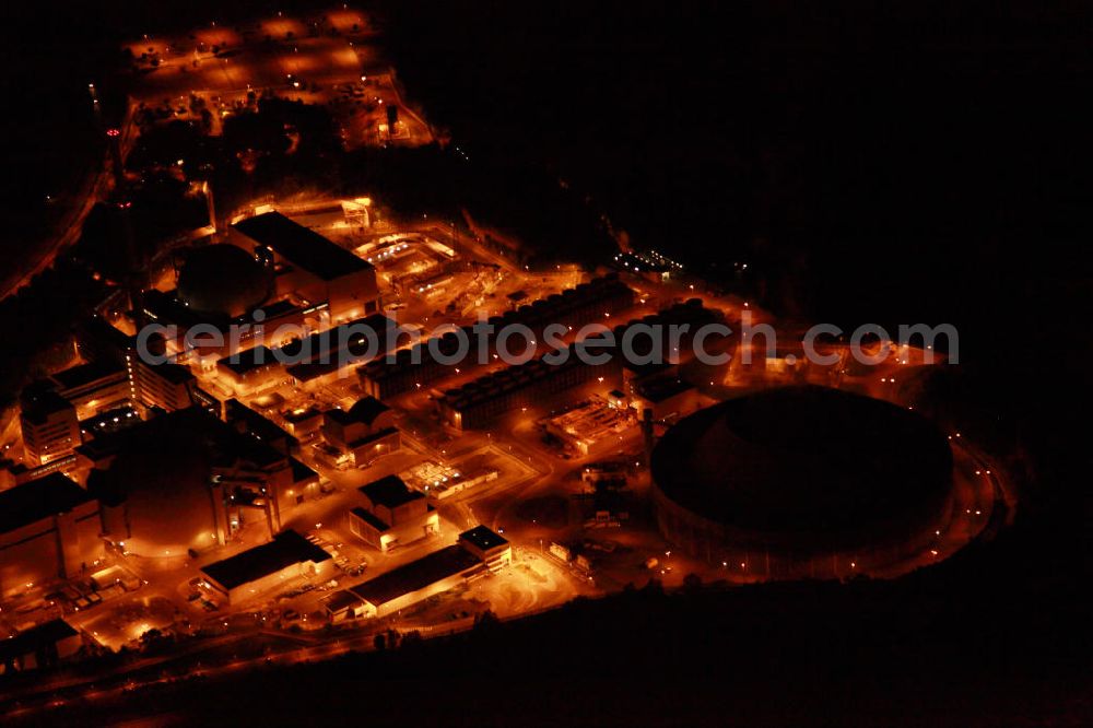 Aerial image at night Neckarwestheim - Nachtluftbildaufnahme vom beleuchteten Areal des Atomkraftwerk Neckarwestheim auf dem Gebiet der Gemeinden Neckarwestheim und Gemmrigheim am Ufer des Neckars. Betreiber des Kraftwerks ist das EnBW-Tochterunternehmen EnBW Kernkraft GmbH.Night Shot: The nuclear power station Neckarwestheim on the right bank of the Neckar river.