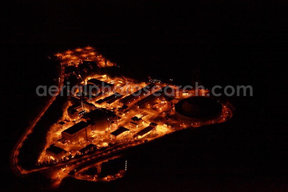 Neckarwestheim at night from above - Nachtluftbildaufnahme vom beleuchteten Areal des Atomkraftwerk Neckarwestheim auf dem Gebiet der Gemeinden Neckarwestheim und Gemmrigheim am Ufer des Neckars. Betreiber des Kraftwerks ist das EnBW-Tochterunternehmen EnBW Kernkraft GmbH.Night Shot: The nuclear power station Neckarwestheim on the right bank of the Neckar river.