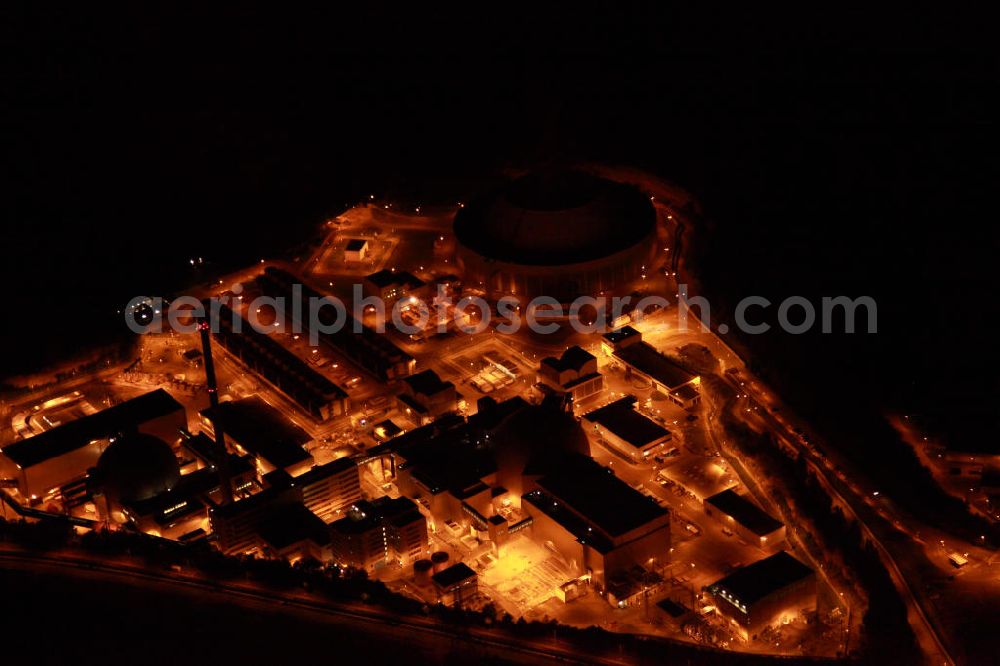 Aerial photograph at night Neckarwestheim - Nachtluftbildaufnahme vom beleuchteten Areal des Atomkraftwerk Neckarwestheim auf dem Gebiet der Gemeinden Neckarwestheim und Gemmrigheim am Ufer des Neckars. Betreiber des Kraftwerks ist das EnBW-Tochterunternehmen EnBW Kernkraft GmbH.Night Shot: The nuclear power station Neckarwestheim on the right bank of the Neckar river.