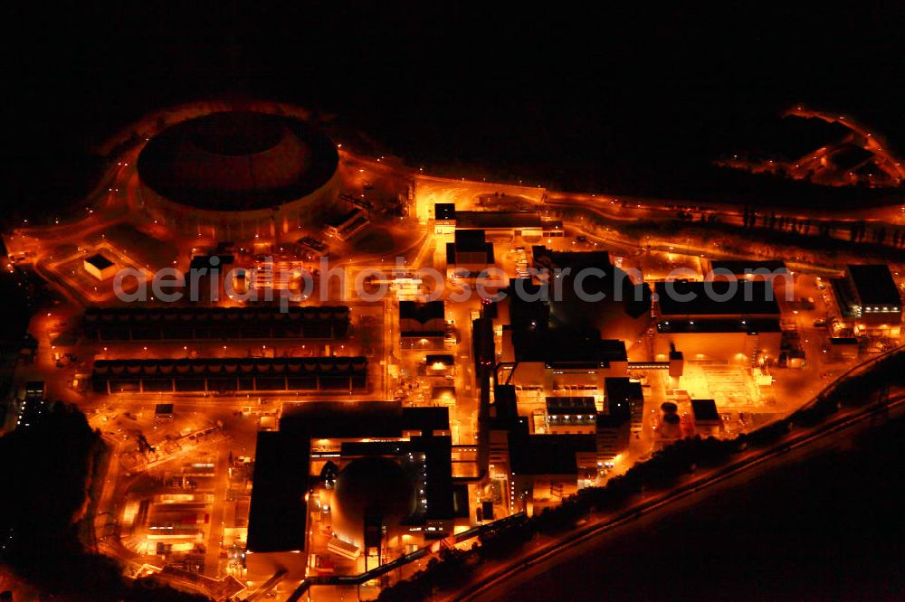 Aerial image at night Neckarwestheim - Nachtluftbildaufnahme vom beleuchteten Areal des Atomkraftwerk Neckarwestheim auf dem Gebiet der Gemeinden Neckarwestheim und Gemmrigheim am Ufer des Neckars. Betreiber des Kraftwerks ist das EnBW-Tochterunternehmen EnBW Kernkraft GmbH.Night Shot: The nuclear power station Neckarwestheim on the right bank of the Neckar river.