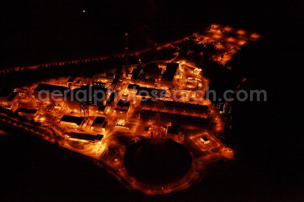 Neckarwestheim at night from above - Nachtluftbildaufnahme vom beleuchteten Areal des Atomkraftwerk Neckarwestheim auf dem Gebiet der Gemeinden Neckarwestheim und Gemmrigheim am Ufer des Neckars. Betreiber des Kraftwerks ist das EnBW-Tochterunternehmen EnBW Kernkraft GmbH.Night Shot: The nuclear power station Neckarwestheim on the right bank of the Neckar river.