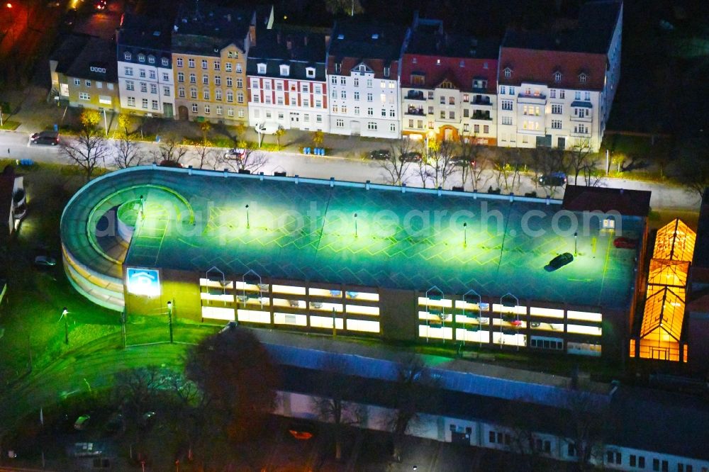 Strausberg at night from above - Night lighting Parking deck on the building of the car park on Hegermuehlenstrasse in Strausberg in the state Brandenburg, Germany