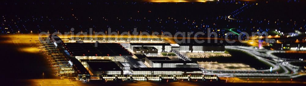 Schönefeld at night from the bird perspective: Site of the new airport BER / BBI AIRPORT BERLIN BRANDENBURG Willi Brandt in Schoenefeld in Brandenburg. The new terminal is in the south of the airport Berlin -Schoenefeld quality built