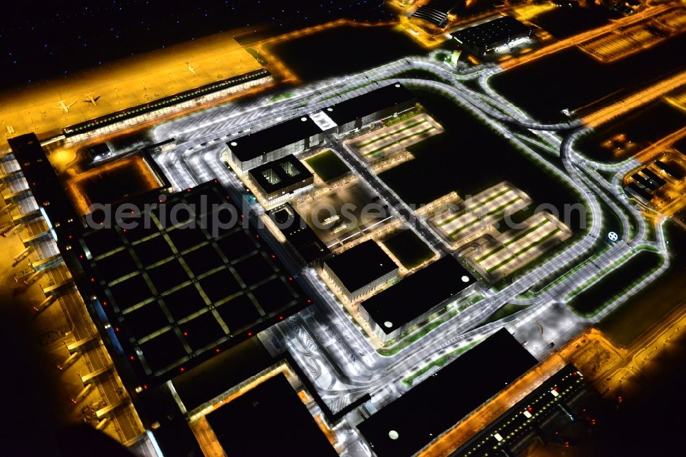 Schönefeld at night from the bird perspective: Site of the new airport BER / BBI AIRPORT BERLIN BRANDENBURG Willi Brandt in Schoenefeld in Brandenburg. The new terminal is in the south of the airport Berlin -Schoenefeld quality built