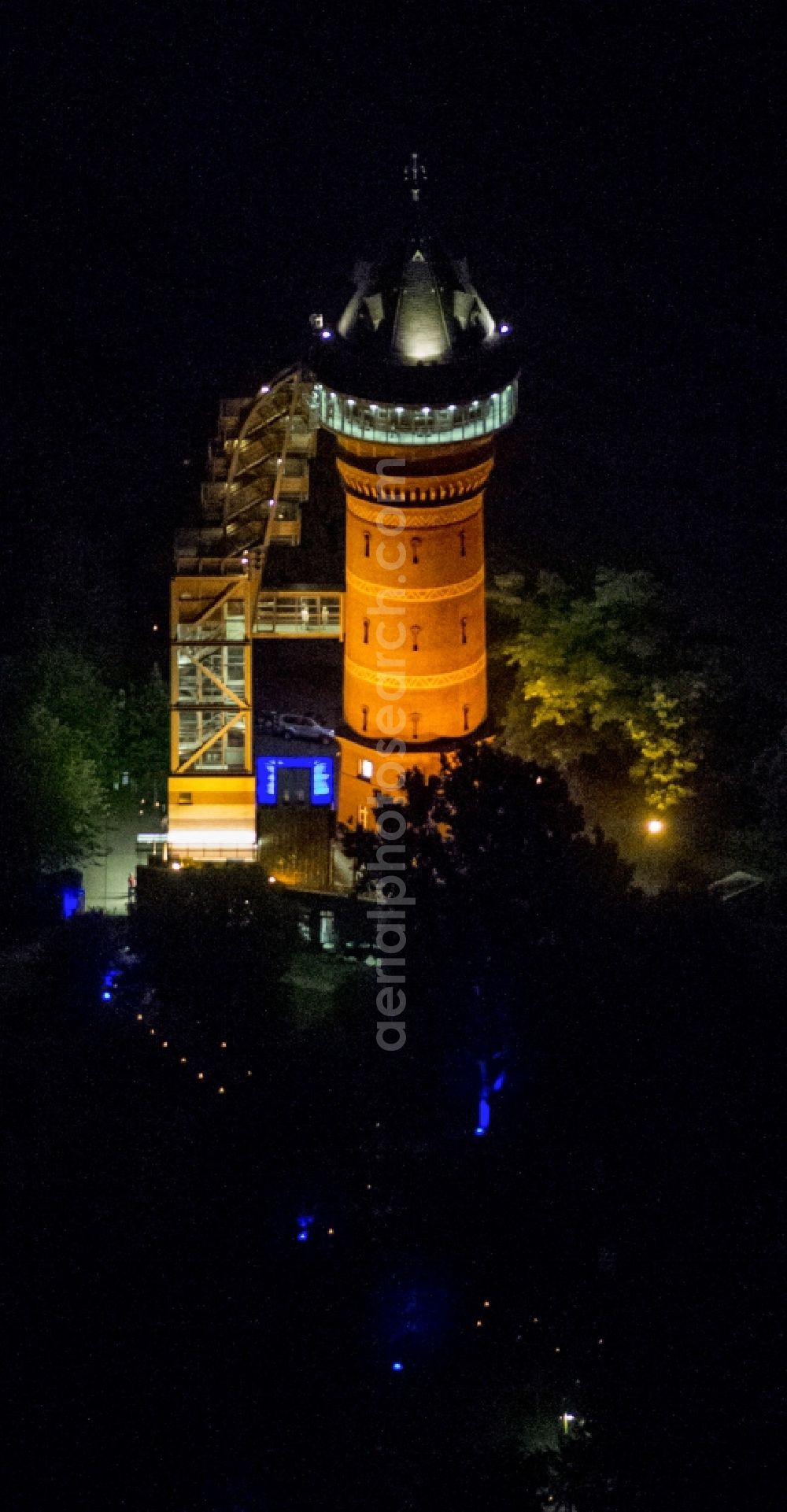 Mülheim at night from above - The Aquarius Water Museum in Styrum, a district of Mülheim an der Ruhr, is located in a disused water tower and is part of the Route of Industrial Heritage