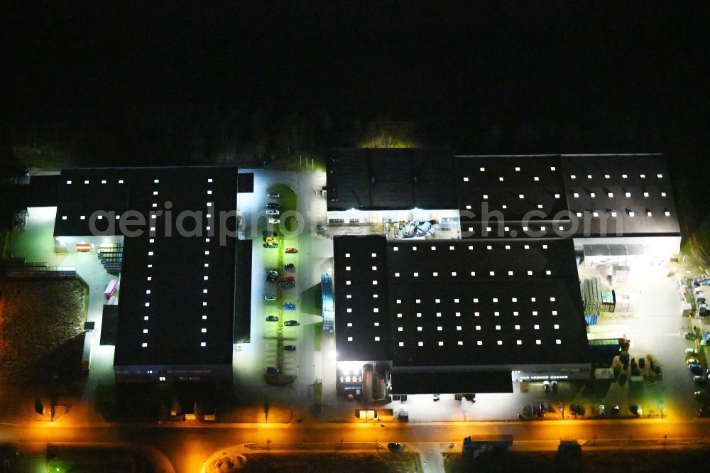 Hattorf-Heiligendorf at night from above - Night lighting Building and production halls on the premises of Grupo Antolin-Deutschlond and of Roechling Automotive KG on Lehmkuhlenfeld in Hattorf-Heiligendorf in the state Lower Saxony, Germany