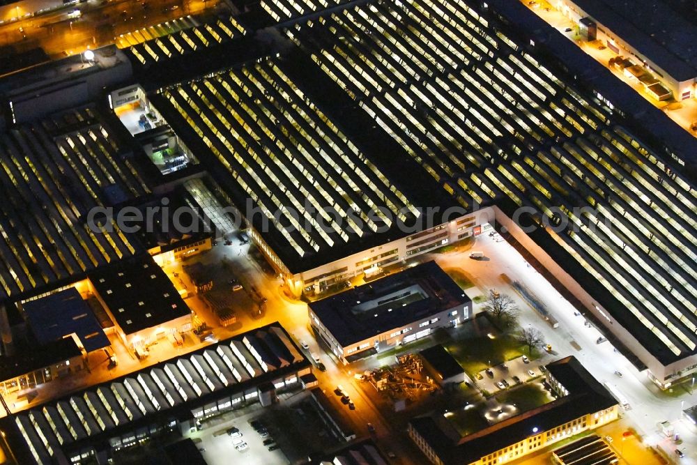 Aerial image at night Braunschweig - Night lighting Building and production halls on the premises of VW Volkswagen AG in Braunschweig in the state Lower Saxony