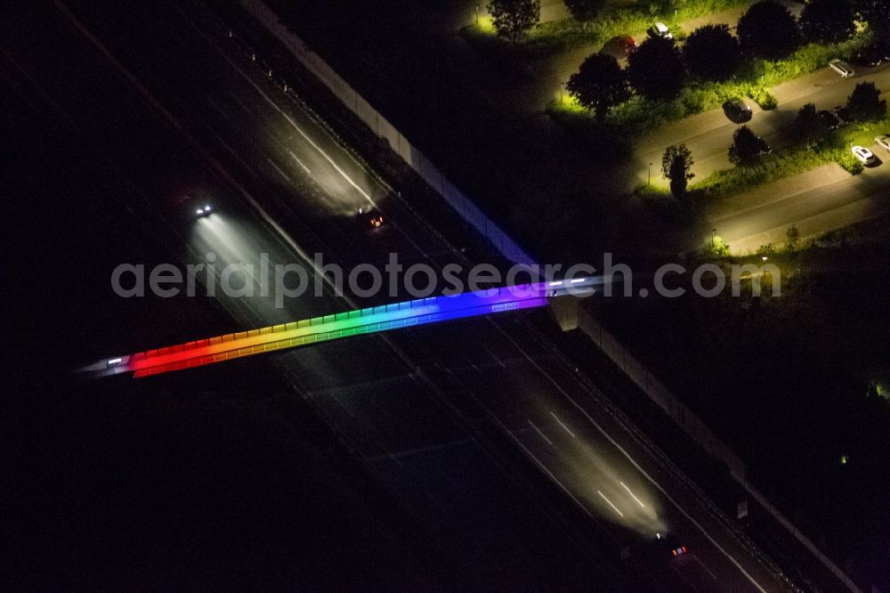 Dortmund at night from the bird perspective: Bridge over the highway at night