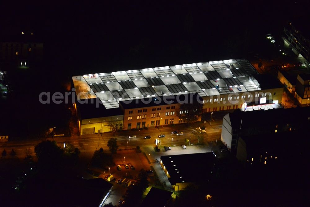 Potsdam at night from above - Night aerial photo of a subsidiary of the food chain Kaufland in Potsdam in the state Brandenburg