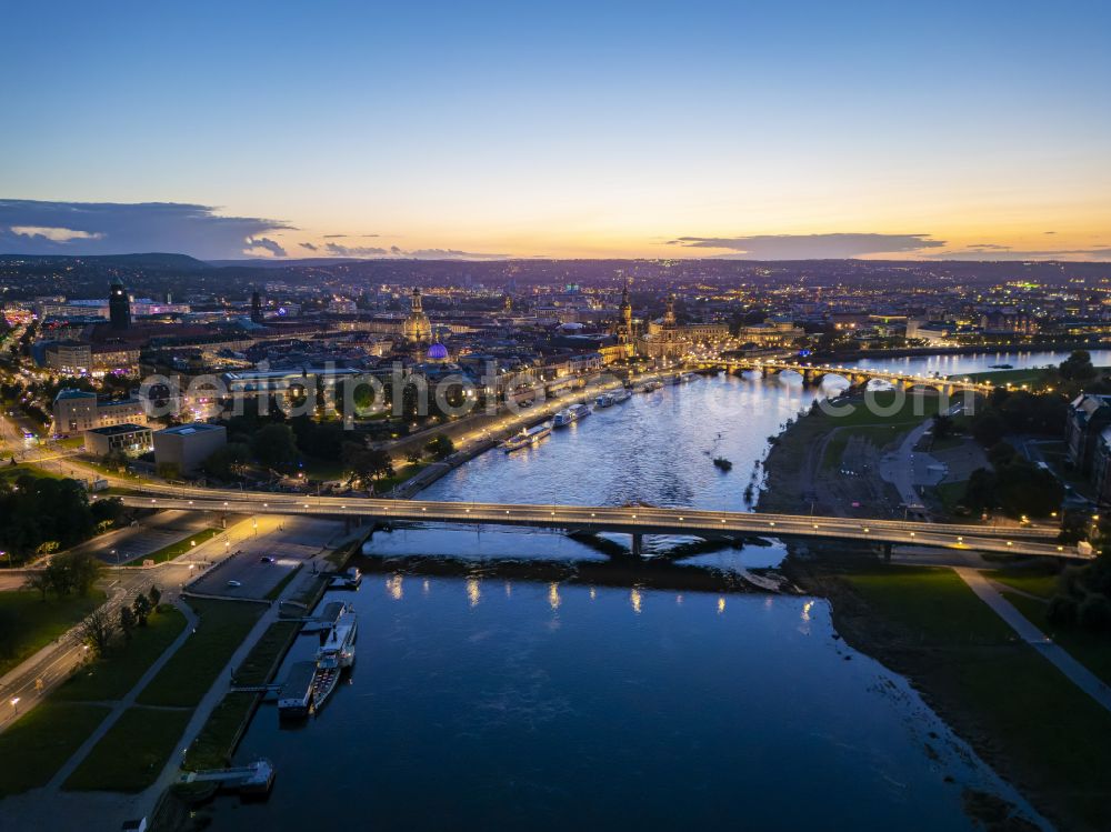 Dresden at night from the bird perspective: Night lighting concrete segments of the collapsed river bridge structure for crossing the Elbe Carolabruecke on the street Carolabruecke in Dresden in the federal state of Saxony, Germany, have fallen down into the riverbed of the Elbe