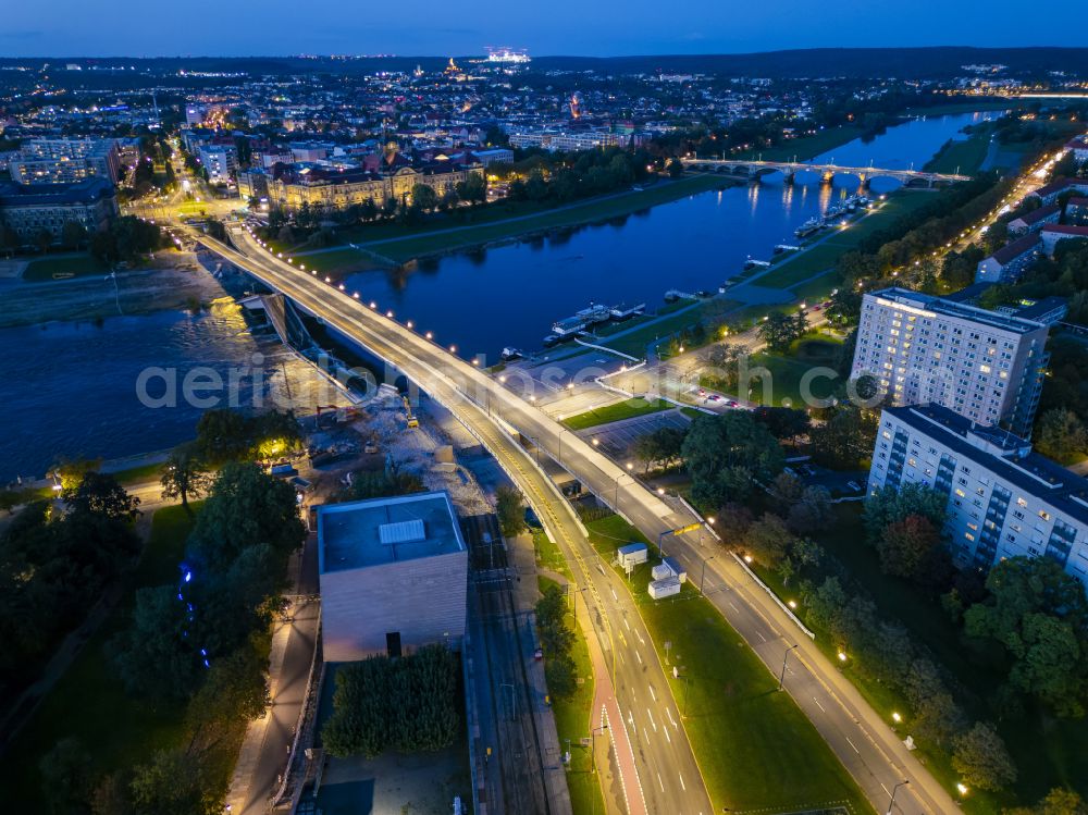 Dresden at night from above - Night lighting concrete segments of the collapsed river bridge structure for crossing the Elbe Carolabruecke on the street Carolabruecke in Dresden in the federal state of Saxony, Germany, have fallen down into the riverbed of the Elbe