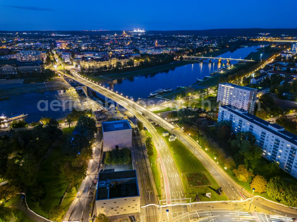 Dresden at night from above - Night lighting concrete segments of the collapsed river bridge structure for crossing the Elbe Carolabruecke on the street Carolabruecke in Dresden in the federal state of Saxony, Germany, have fallen down into the riverbed of the Elbe