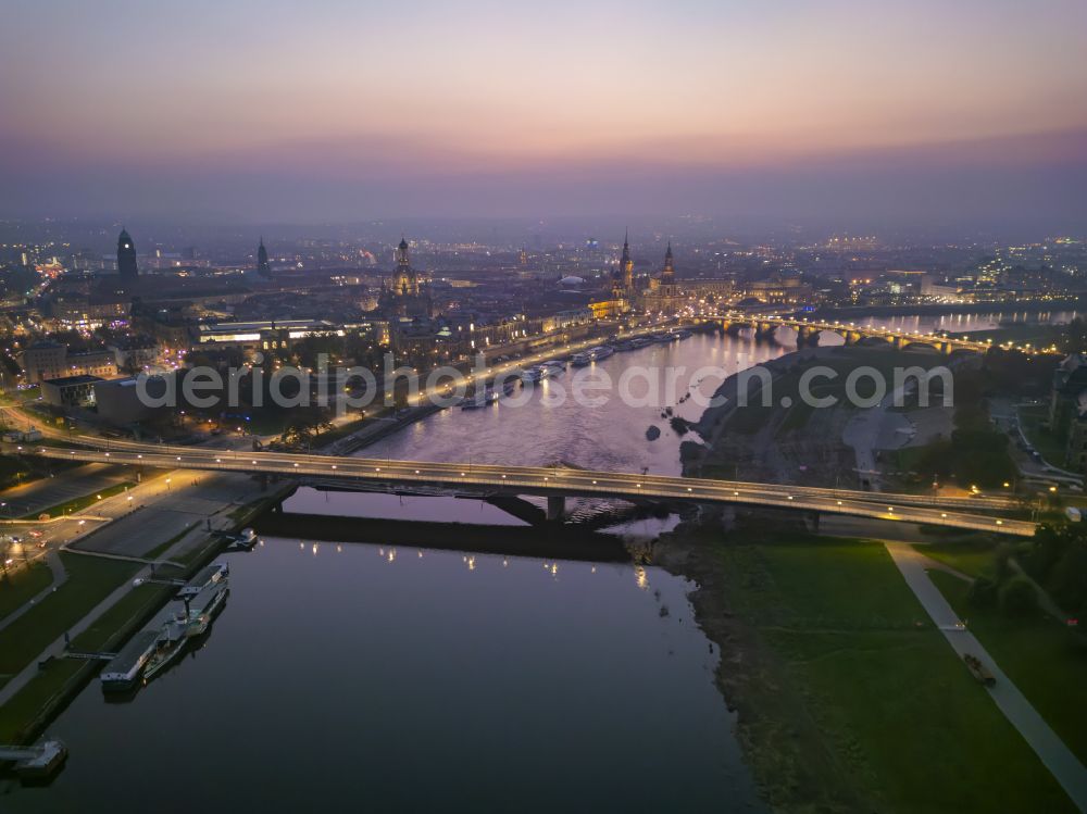 Aerial image at night Dresden - Night lighting concrete segments of the collapsed river bridge structure for crossing the Elbe Carolabruecke on the street Carolabruecke in Dresden in the federal state of Saxony, Germany, have fallen down into the riverbed of the Elbe