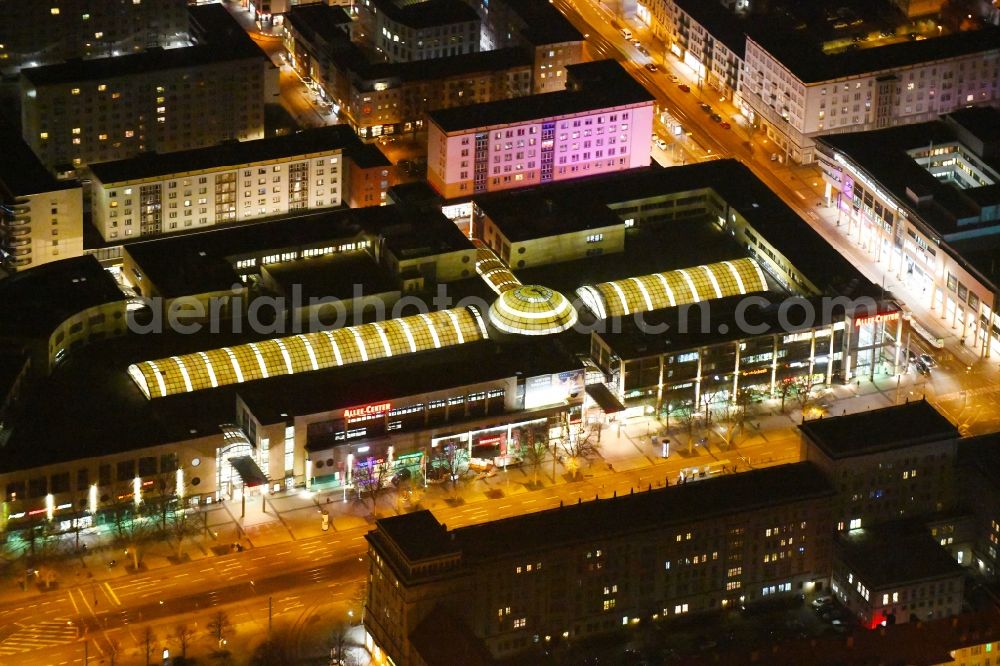 Aerial photograph at night Magdeburg - Night lighting Building of the shopping center Allee-Center Magdeburg on street Ernst-Reuter-Allee in the district Zentrum in Magdeburg in the state Saxony-Anhalt, Germany