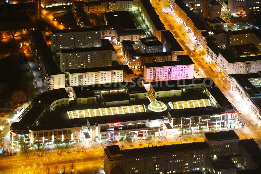 Aerial image at night Magdeburg - Night lighting Building of the shopping center Allee-Center Magdeburg on street Ernst-Reuter-Allee in the district Zentrum in Magdeburg in the state Saxony-Anhalt, Germany