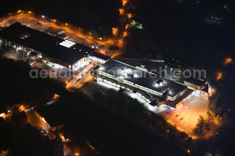 Aerial image at night Bernau - Night lighting Building of the shopping center Bahnhofs-Passage Bernau in Bernau in the state Brandenburg, Germany