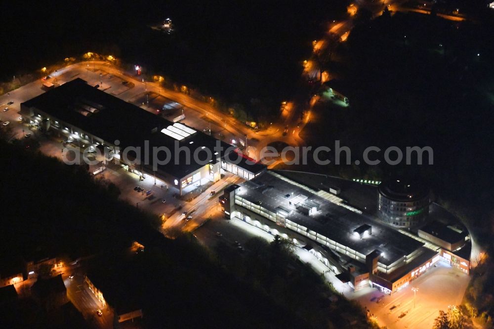 Bernau at night from above - Night lighting Building of the shopping center Bahnhofs-Passage Bernau in Bernau in the state Brandenburg, Germany