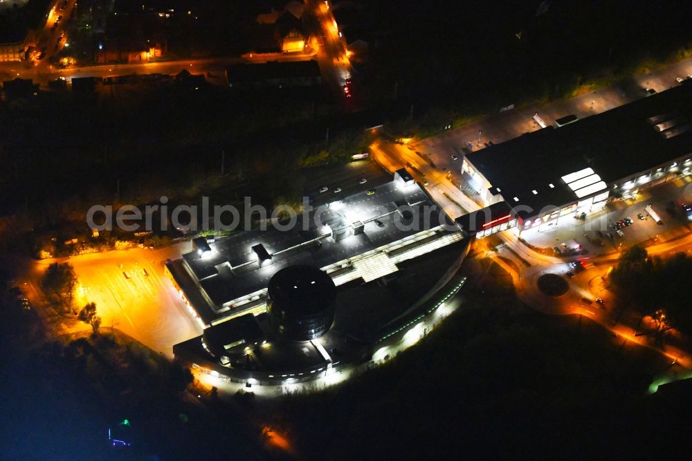 Aerial image at night Bernau - Night lighting Building of the shopping center Bahnhofs-Passage Bernau in Bernau in the state Brandenburg, Germany