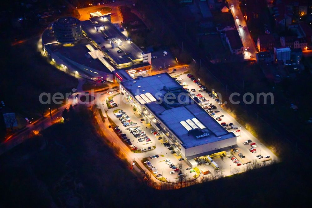 Aerial image at night Bernau - Night lighting Building of the shopping center Bahnhofs-Passage Bernau in Bernau in the state Brandenburg, Germany