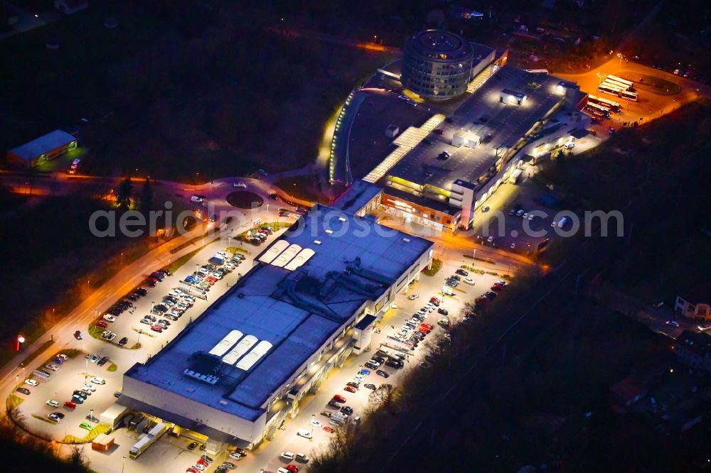 Bernau at night from above - Night lighting Building of the shopping center Bahnhofs-Passage Bernau in Bernau in the state Brandenburg, Germany