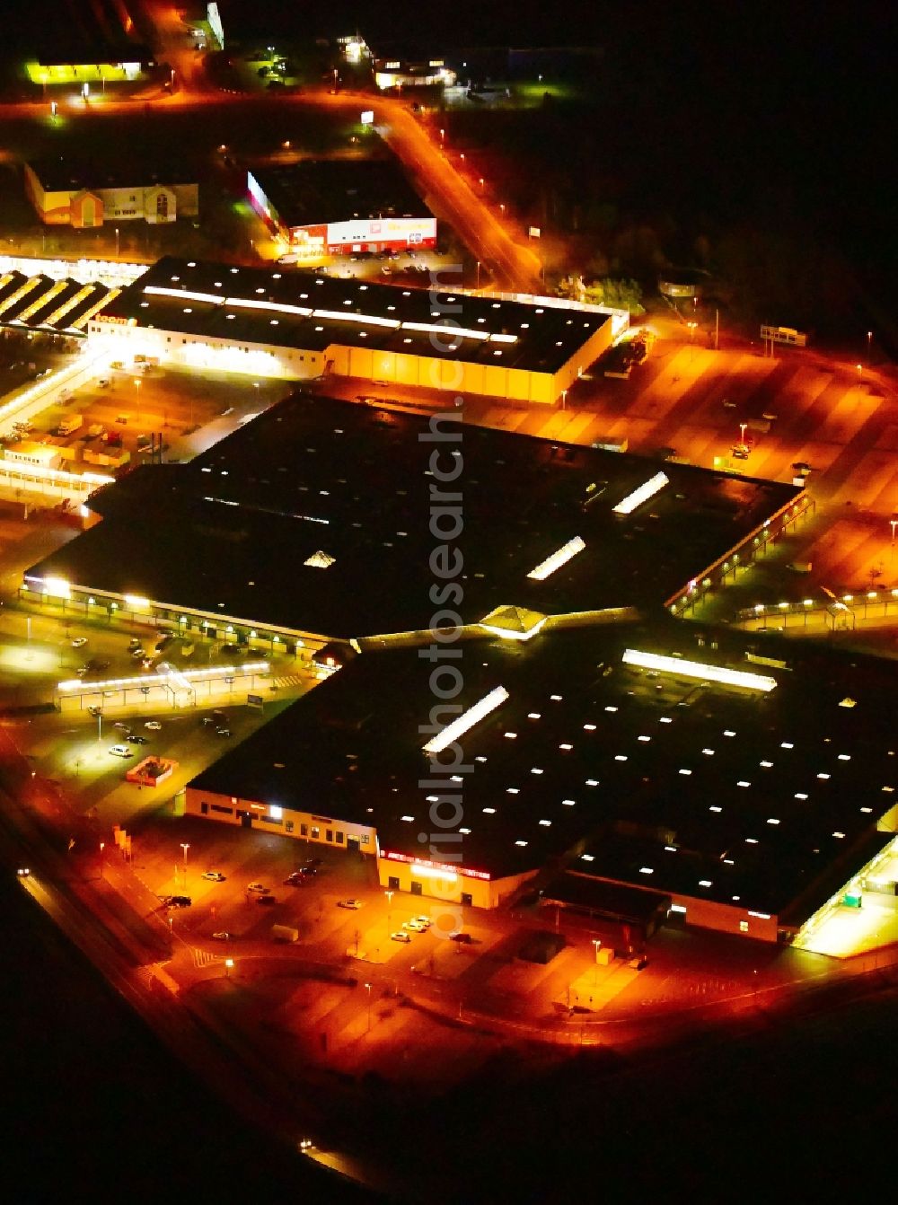 Brandenburg an der Havel at night from above - Night lighting building of the shopping center Brondenburger Einkaufszentrum Wust An of Bundesstrasse in Wust in the state Brandenburg, Germany