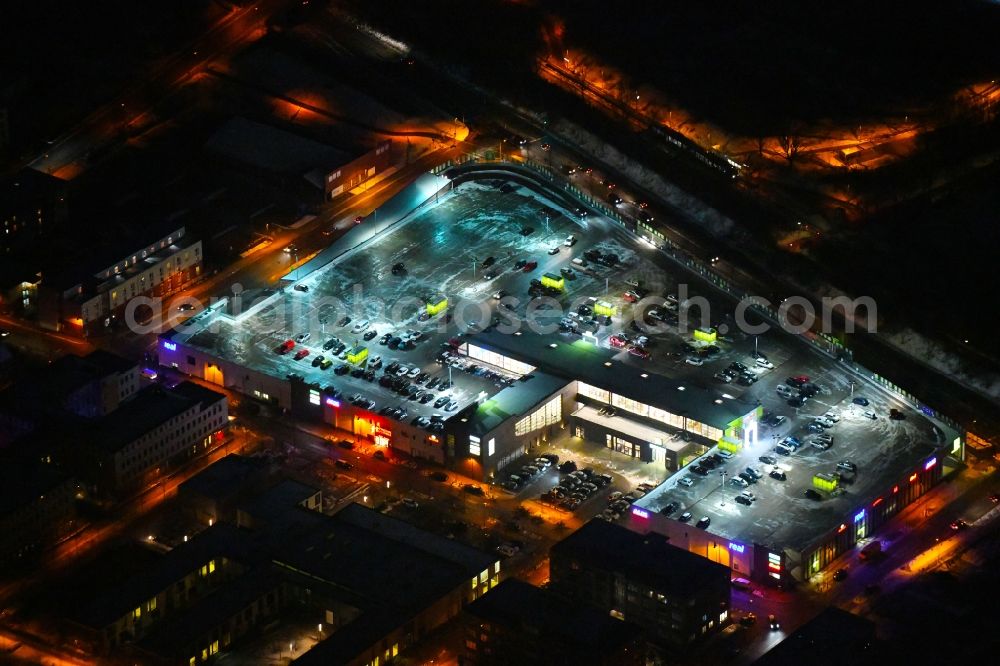 Lübeck at night from the bird perspective: Night lighting building of the shopping center Campus Luebeck on Alexander-Fleming-Strasse in the district Strecknitz in Luebeck in the state Schleswig-Holstein, Germany