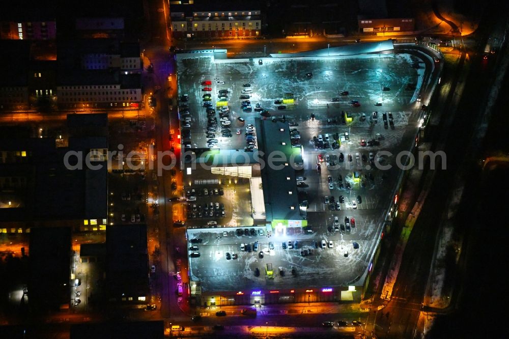 Aerial image at night Lübeck - Night lighting building of the shopping center Campus Luebeck on Alexander-Fleming-Strasse in the district Strecknitz in Luebeck in the state Schleswig-Holstein, Germany