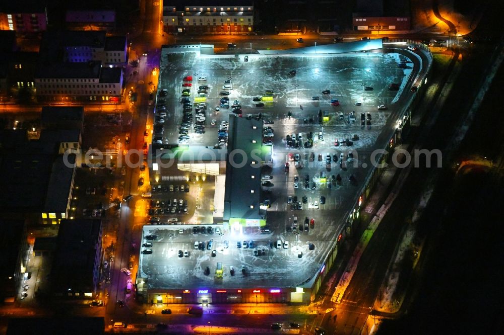 Lübeck at night from above - Night lighting building of the shopping center Campus Luebeck on Alexander-Fleming-Strasse in the district Strecknitz in Luebeck in the state Schleswig-Holstein, Germany