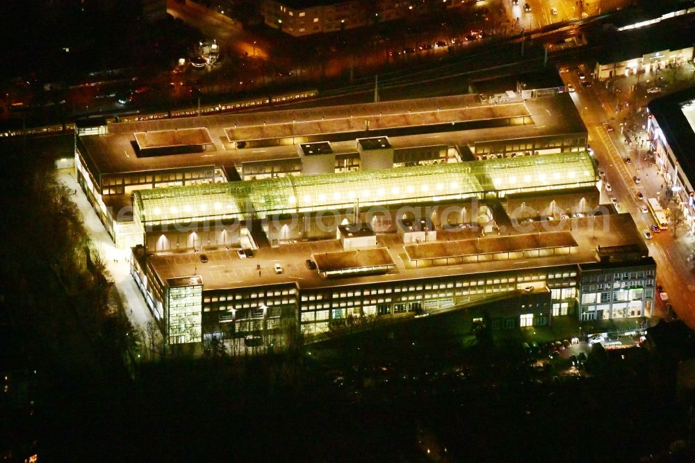 Aerial photograph at night Berlin - Night lighting building of the shopping center Forum Koepenick in the district Koepenick in Berlin, Germany