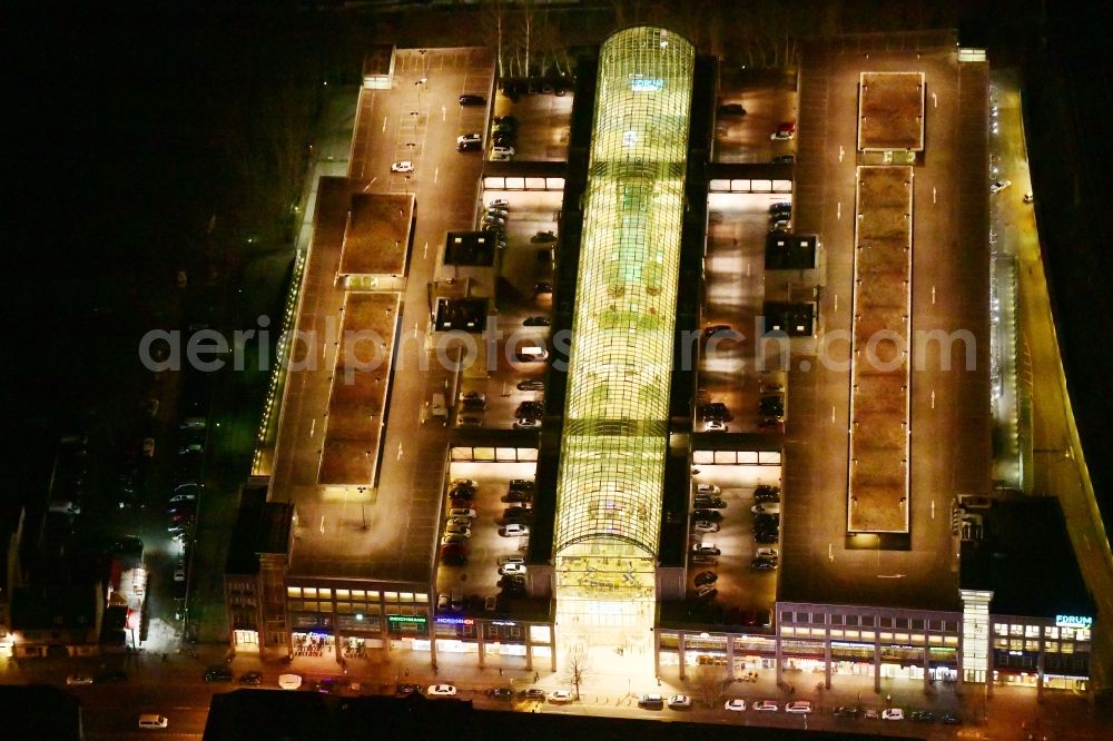 Berlin at night from above - Night lighting building of the shopping center Forum Koepenick in the district Koepenick in Berlin, Germany